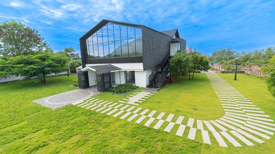 image of the love letter complex with the lush green lawn in front of it - Darza Resorts