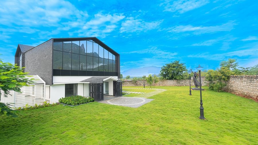 image featuring the love letter complex in one corner and the expansive green lawn in front of it - Darza Resorts