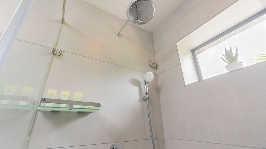 image featuring the shower head of the premium room bathroom - Darza Resorts