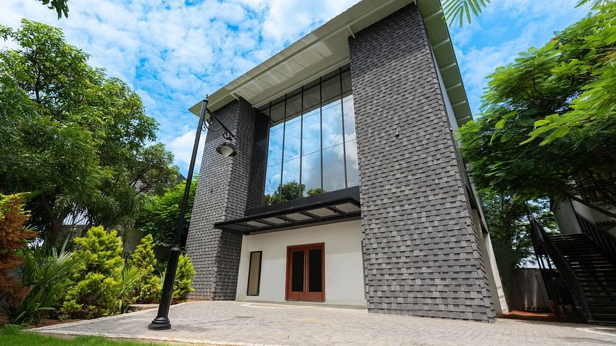 Royal Affair Banquet Hall at Darza Resorts, surrounded by lush green trees, showcasing one of the top marriage halls in Coimbatore.