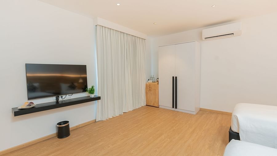 image featuring a spacious garden room along with a wall mounted television - Darza Resorts