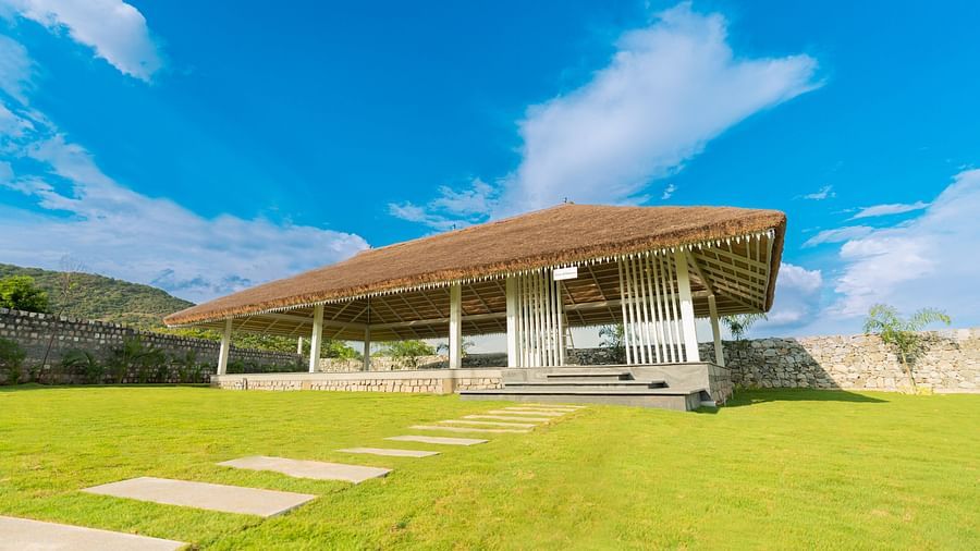close up image of the slice of heaven featuring a sun shade with clear blue sky in the background - Darza Resorts