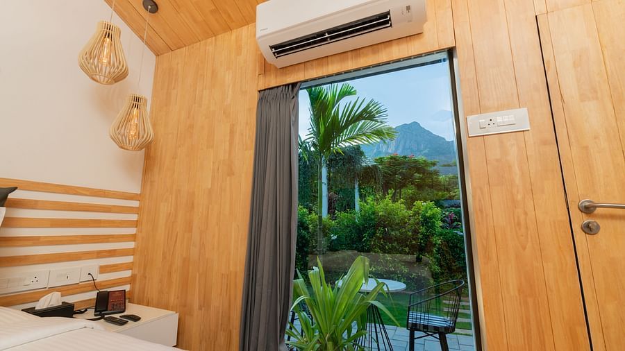 close up image of the views from the window at the premium room with a split ac above it - Darza Resorts