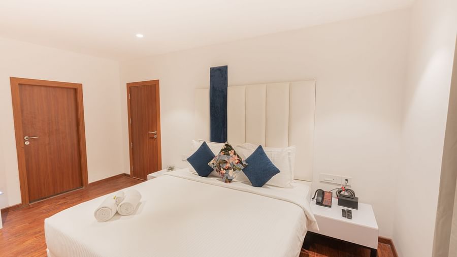 image of a sleek bedroom of the family villa two bedroom featuring a comfortable king size bed - Darza Resorts