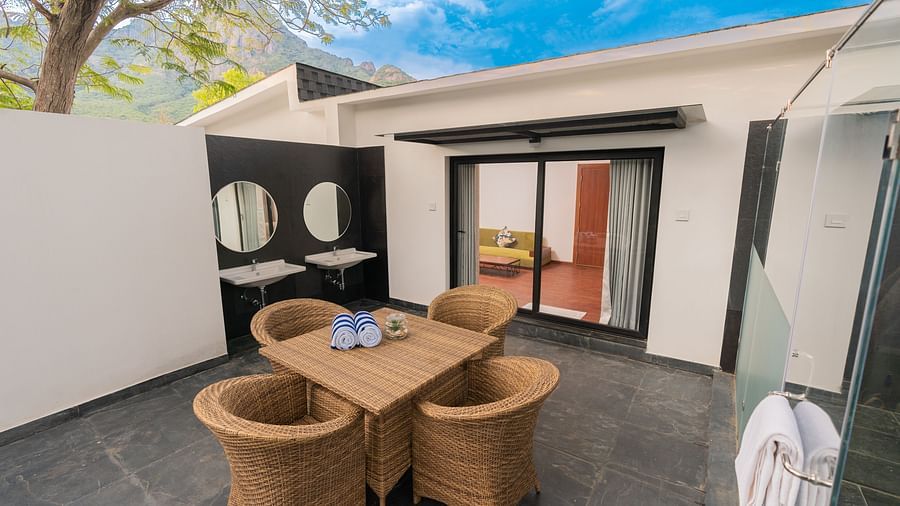 image of the outdoor seating area along with two wash basins in the corner in the family villa two bedroom - Darza Resorts