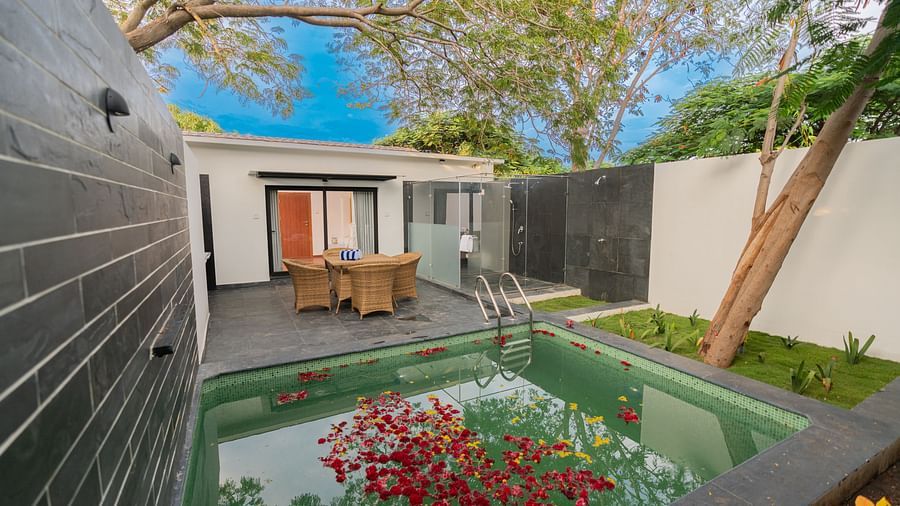 image featuring a private swimming pool besides the private sit out area in the family villa two bedroom - Darza Resorts