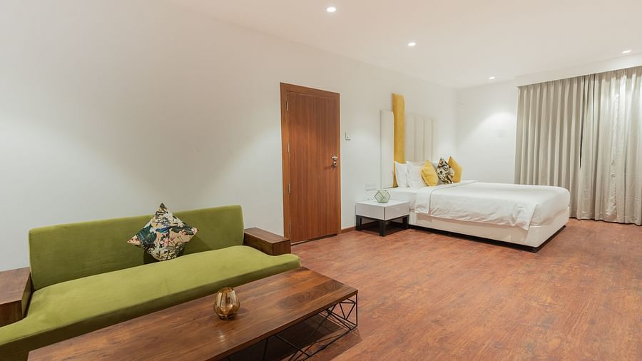 image of the master bedroom of the family villa two bedroom with a couch and a double bed - Darza Resorts