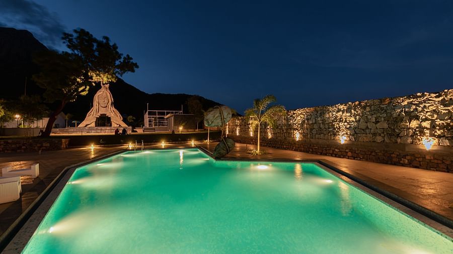 image of the swimming pool with well light night lamps on the walls - Darza Resorts