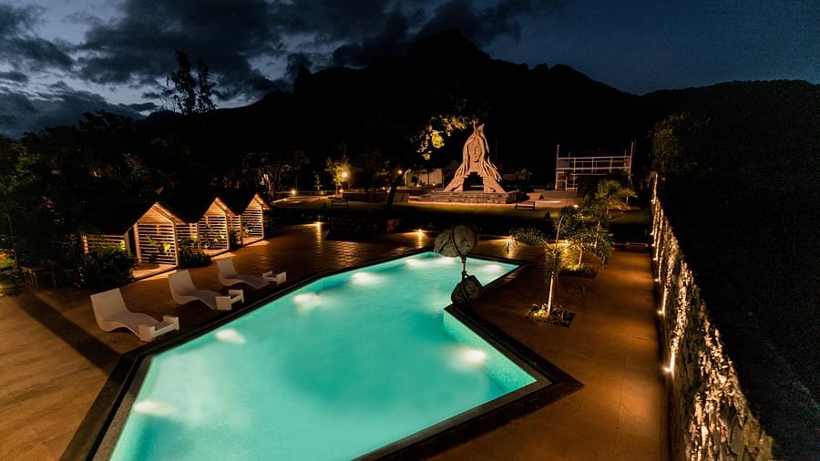 an image taken from a higher angle featuring the sun loungers and the outdoor seating area - Darza Resorts