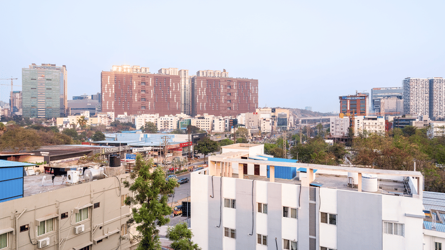 A city view of Gachibowli featuring multi-storey buildings.