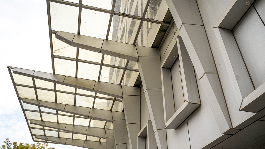Modern architectural exterior of a building featuring sleek lines and glass panels - Hotel Udai Median, Udaipur.