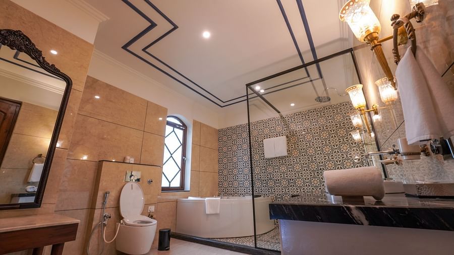 Bathroom at INFINITEA Dak Bungalow, Palampur with a bathtub and a shower cubicle