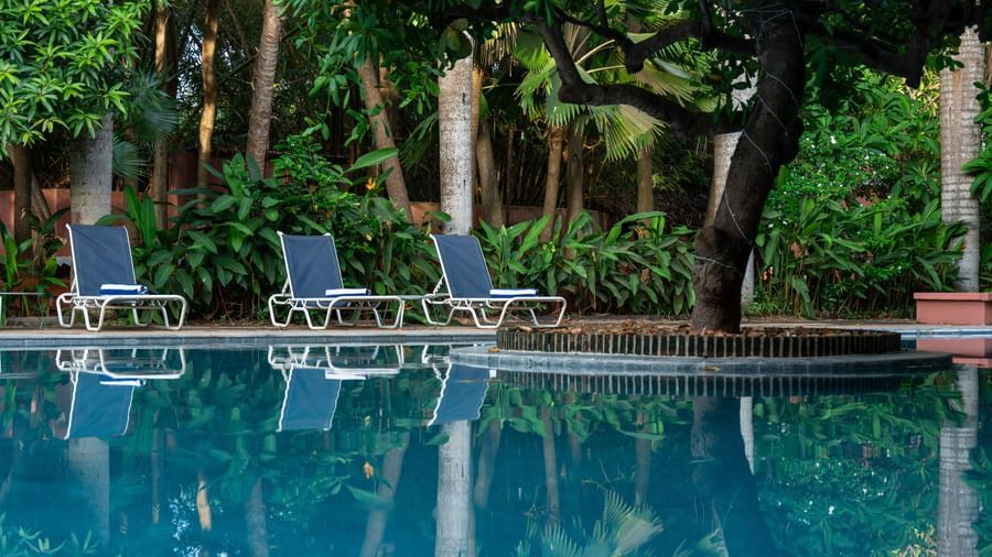 Swimming Pool with lawn chairs