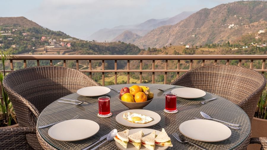 an image of cutlery along with fruits kept on the table at Mountoria Retreat, Naukuchiatal