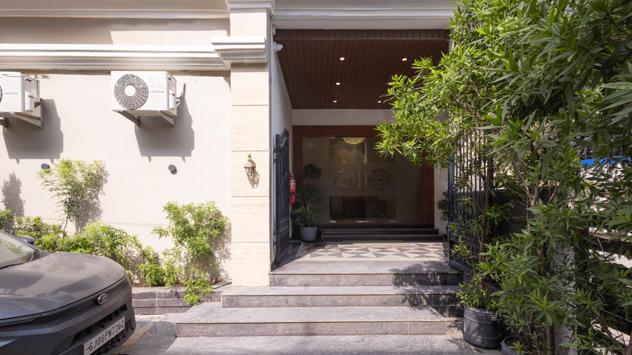 Exterior view of the entrance and steps of Pravasa Stay Luv Kush, Indore.