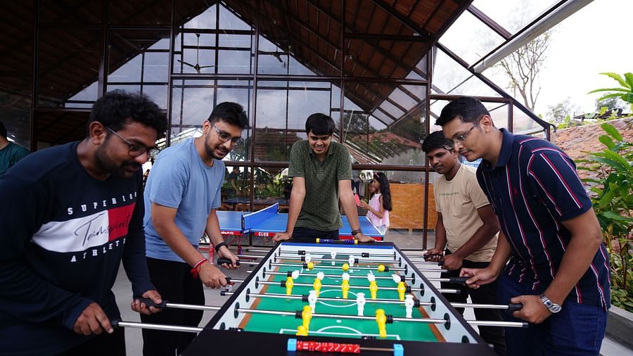 A group of people playing foosball at Ravishing Retreat in Bangalore