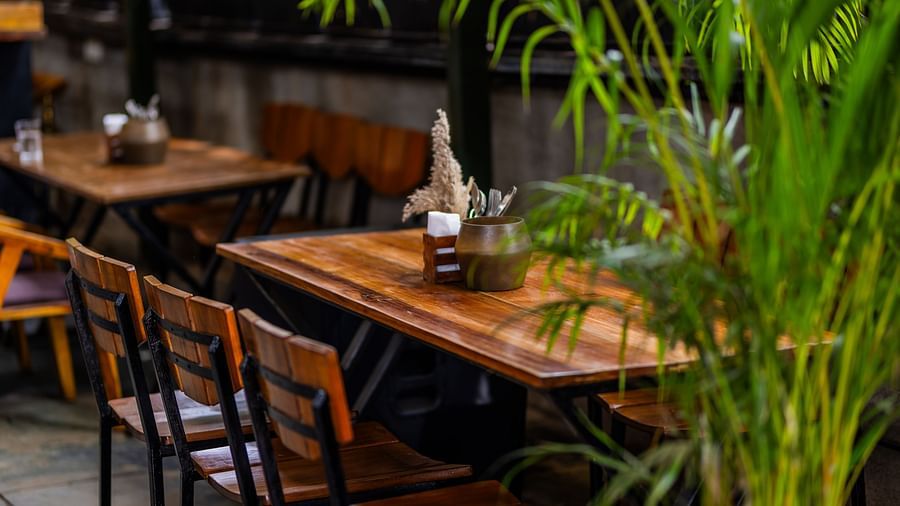 Wooden tables at Love Anna Bar and Restaurant at Royale Amata - By the Beach.