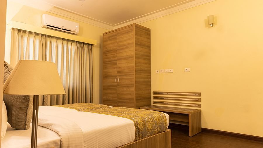 A double bed inside one of the rooms - Starlit Suites, Tirupati