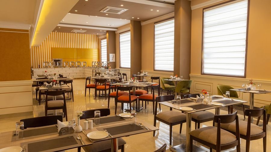 Seating arrangement inside the restaurant 1 - Starlit Suites Tirupati