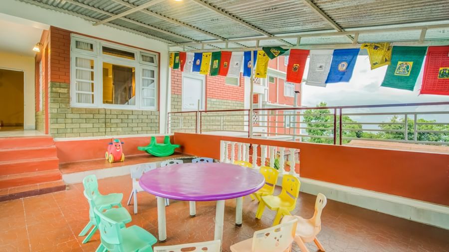 Image of a kids play area with colourful chairs at at Summit Tashi Ghang Heritage Resort, Pelling