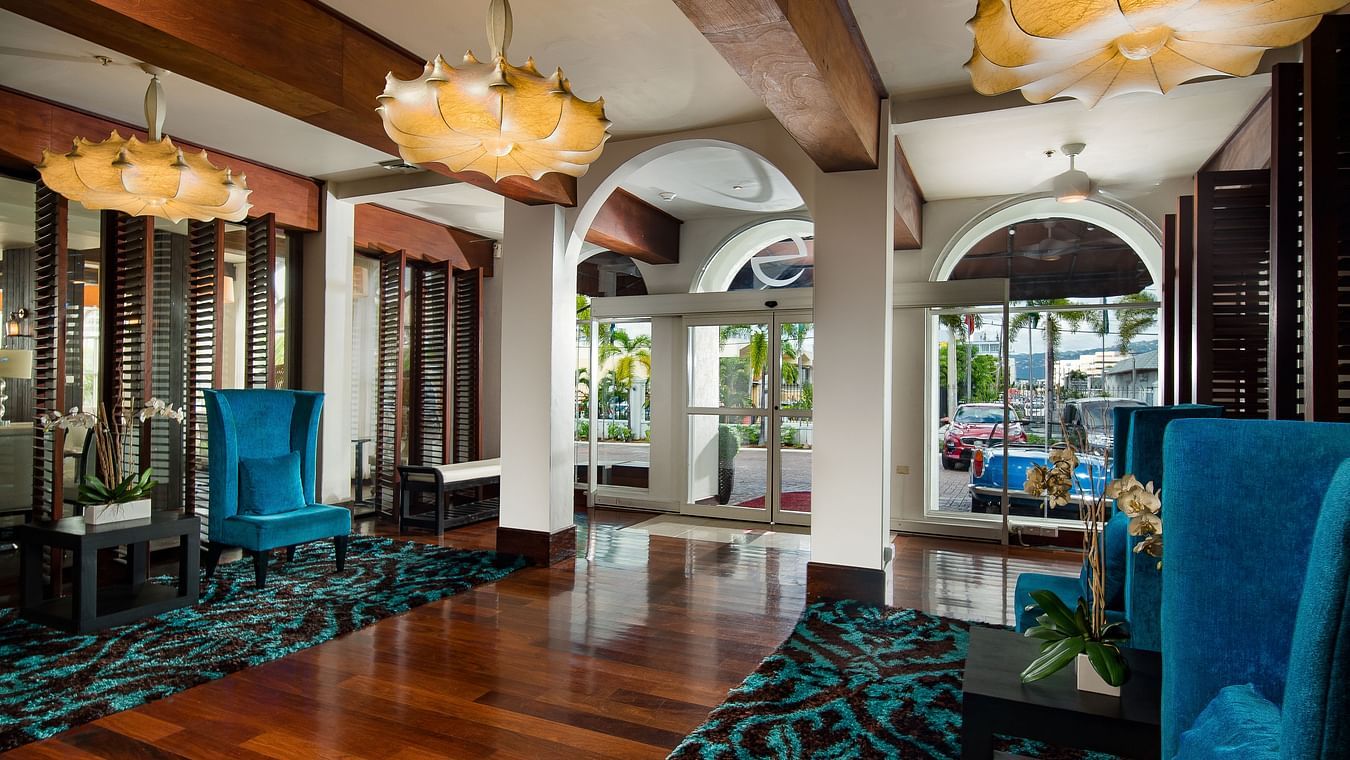 Hotel lounge with vibrant decor and turquoise seating - S Hotel Kingston, Jamaica