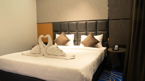 Comfortable bedroom at Magnus Lxia Premier, Kalyani Nagar with plush bedding and modern interiors.