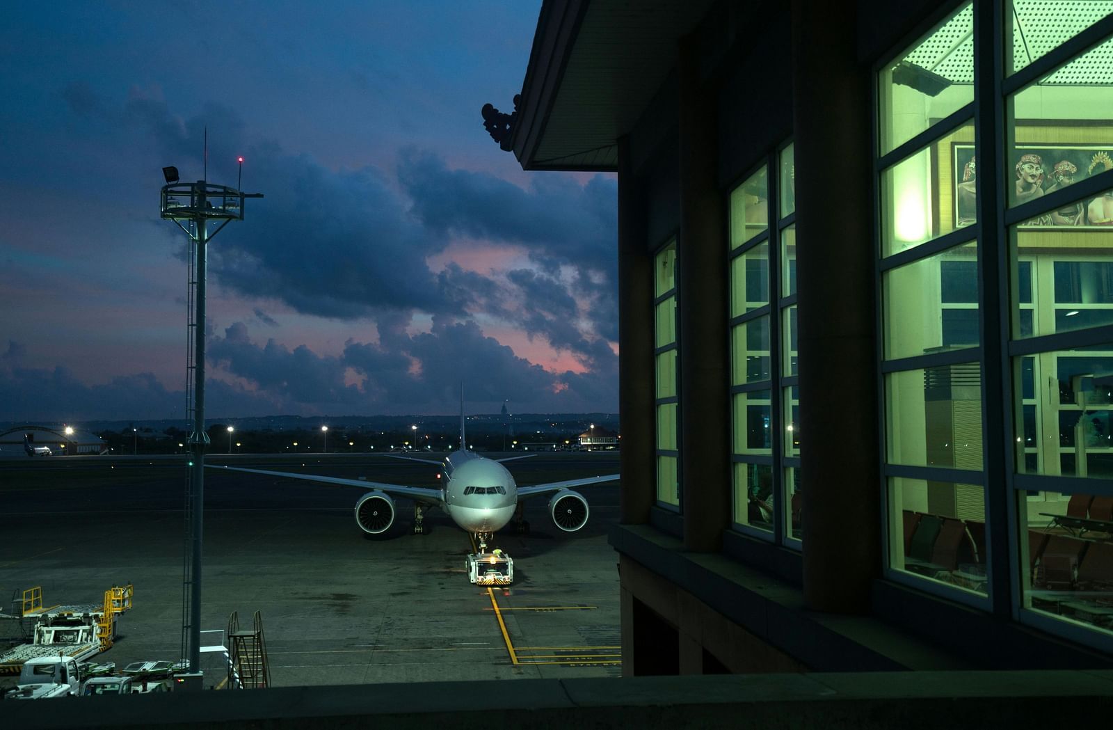 View of a plane parked at an airport during dusk
