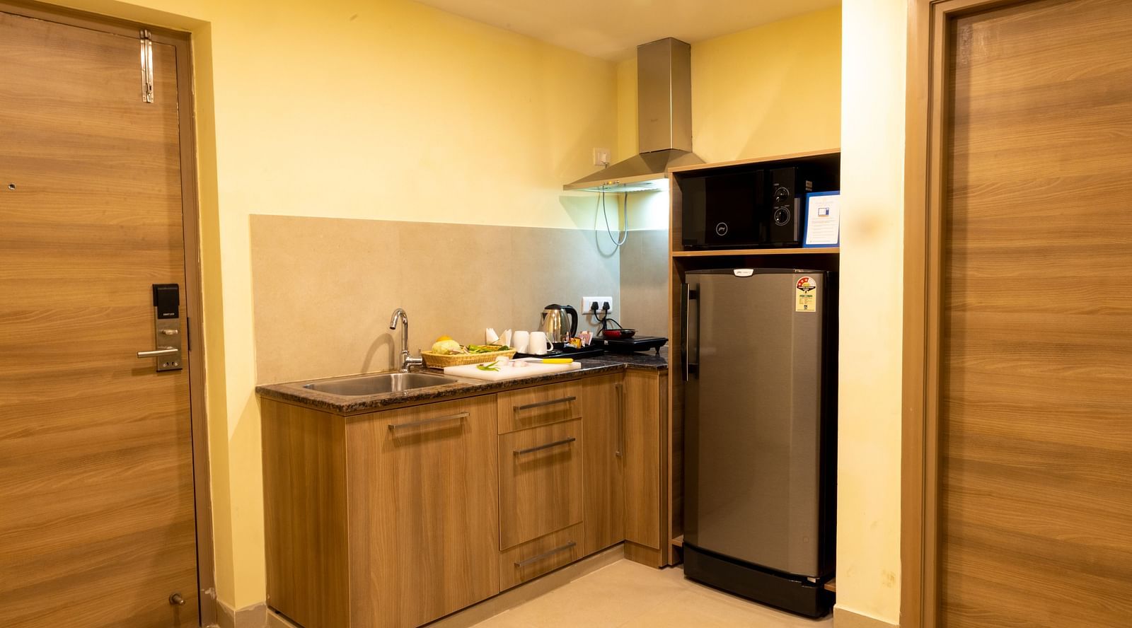 Overview of the kitchenette inside Deluxe Two Bedroom Suite - Starlit Suites, Tirupati