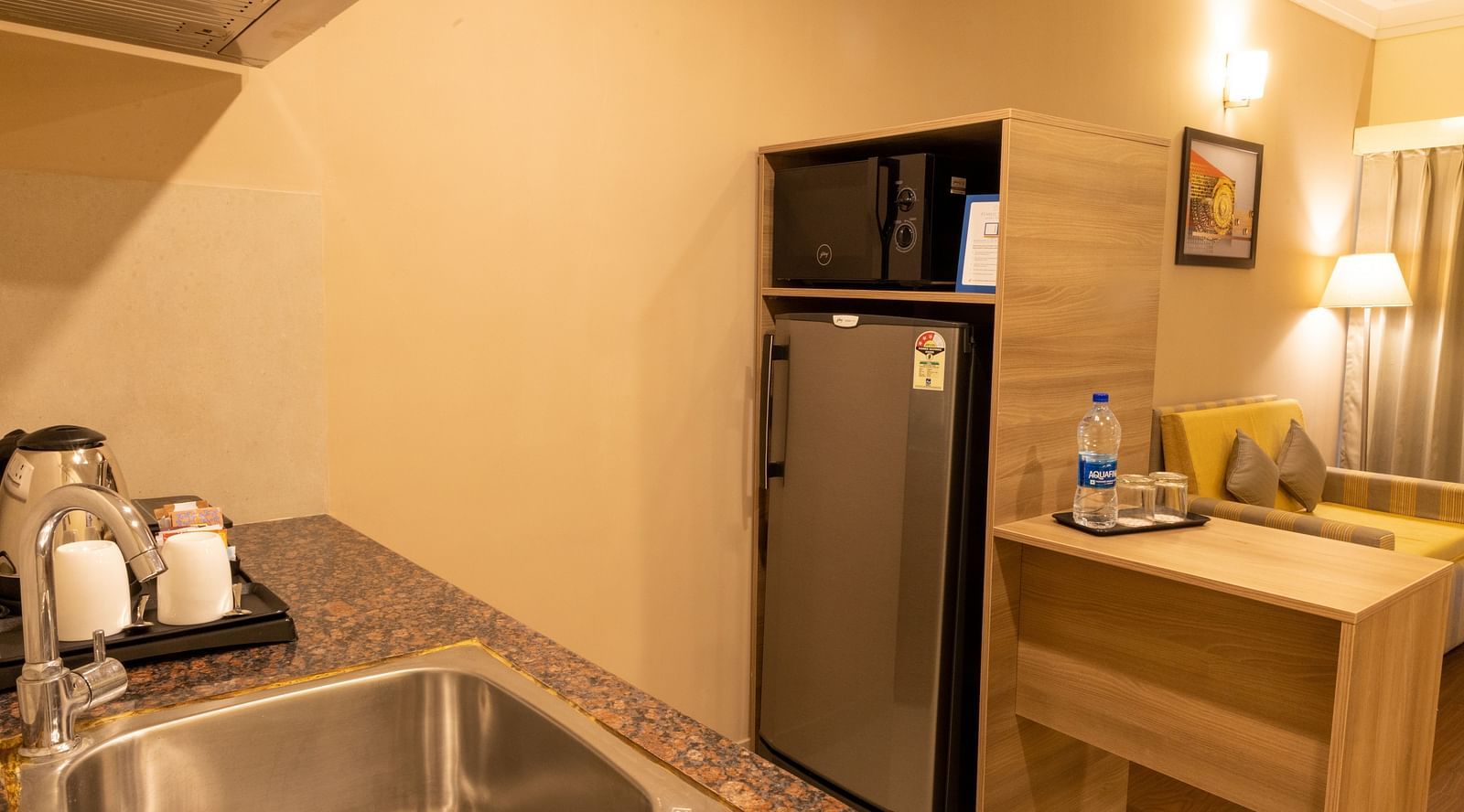 Overview of the kitchenette inside Premium One Bedroom Suite - Starlit Suites, Tirupati