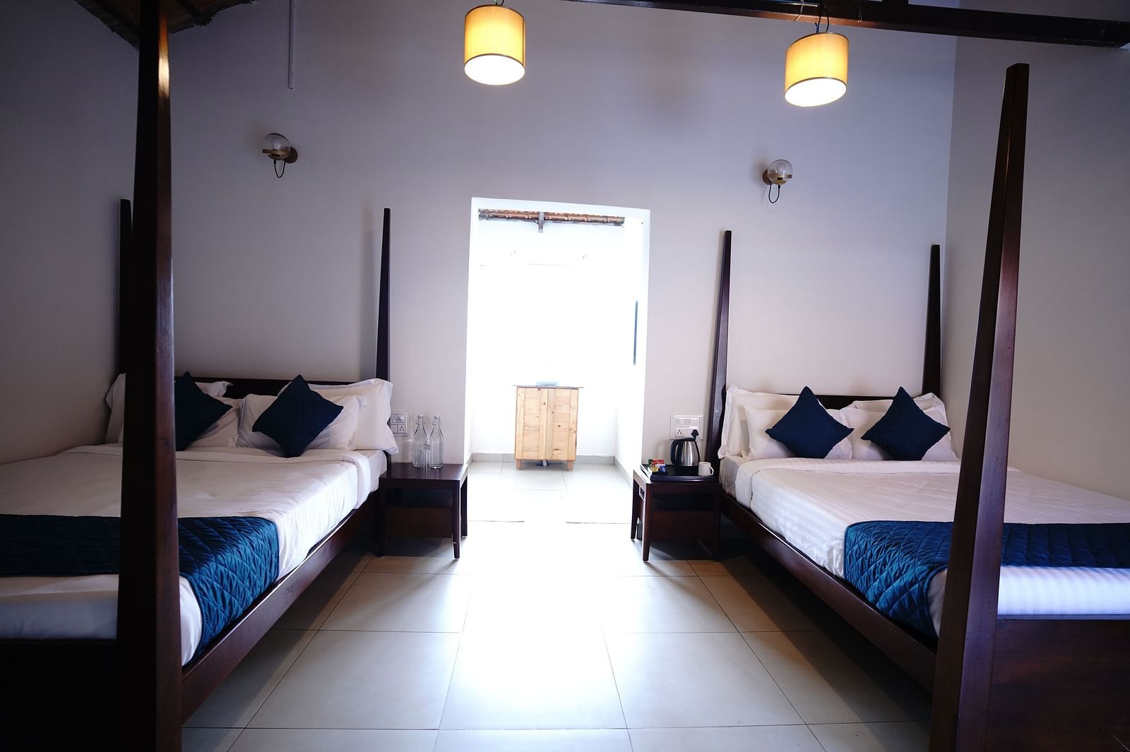 The twin bedding and the interiors of the Plumeria 4 Series at Ravishing Retreat