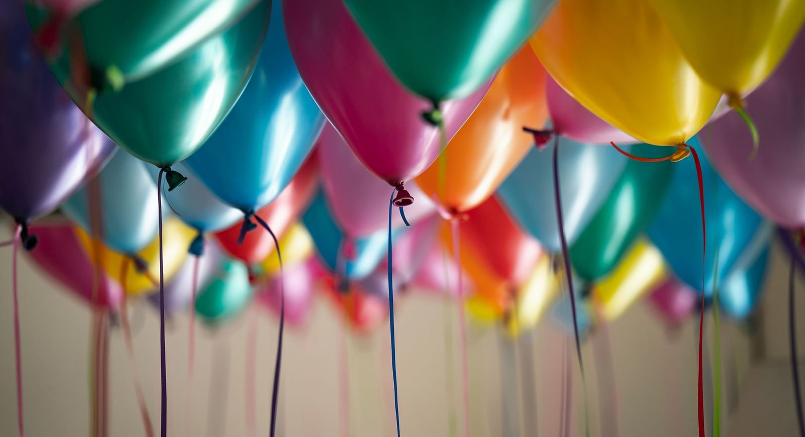 a picture of colourful balloons stuck