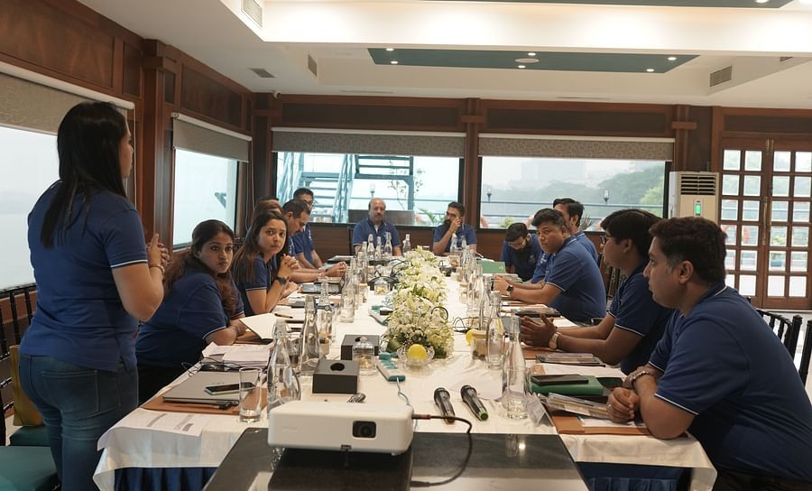 A group of employees at Polo towers having a meeting in a board room