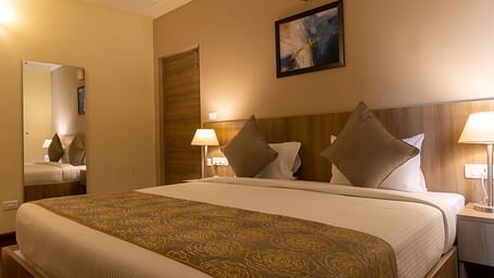 A double bed inside Deluxe One Bedroom Suite - Starlit Suites, Tirupati