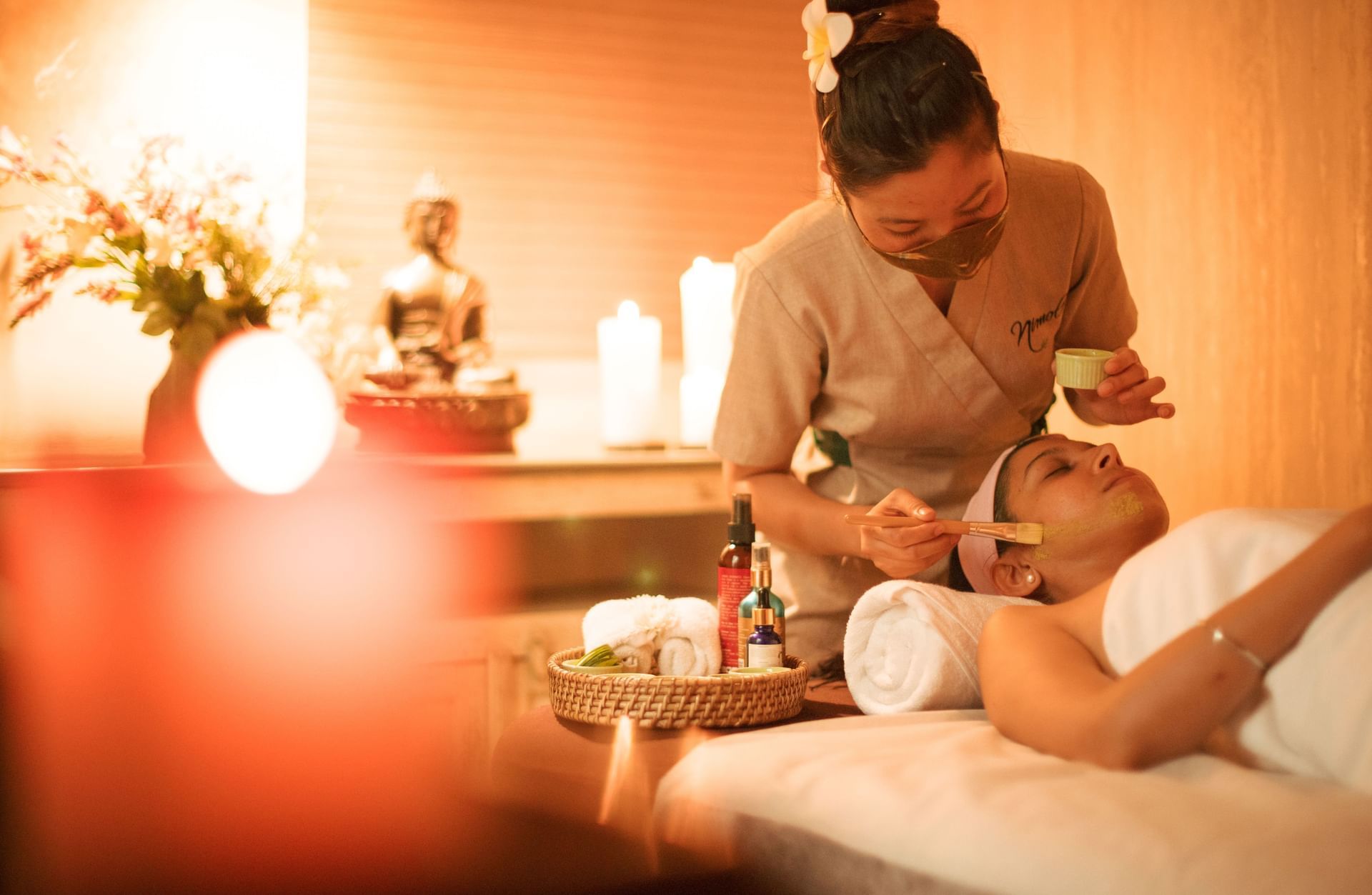 Guest receiving a soothing massage during a spa session in the wellness center at Karma Chalets.