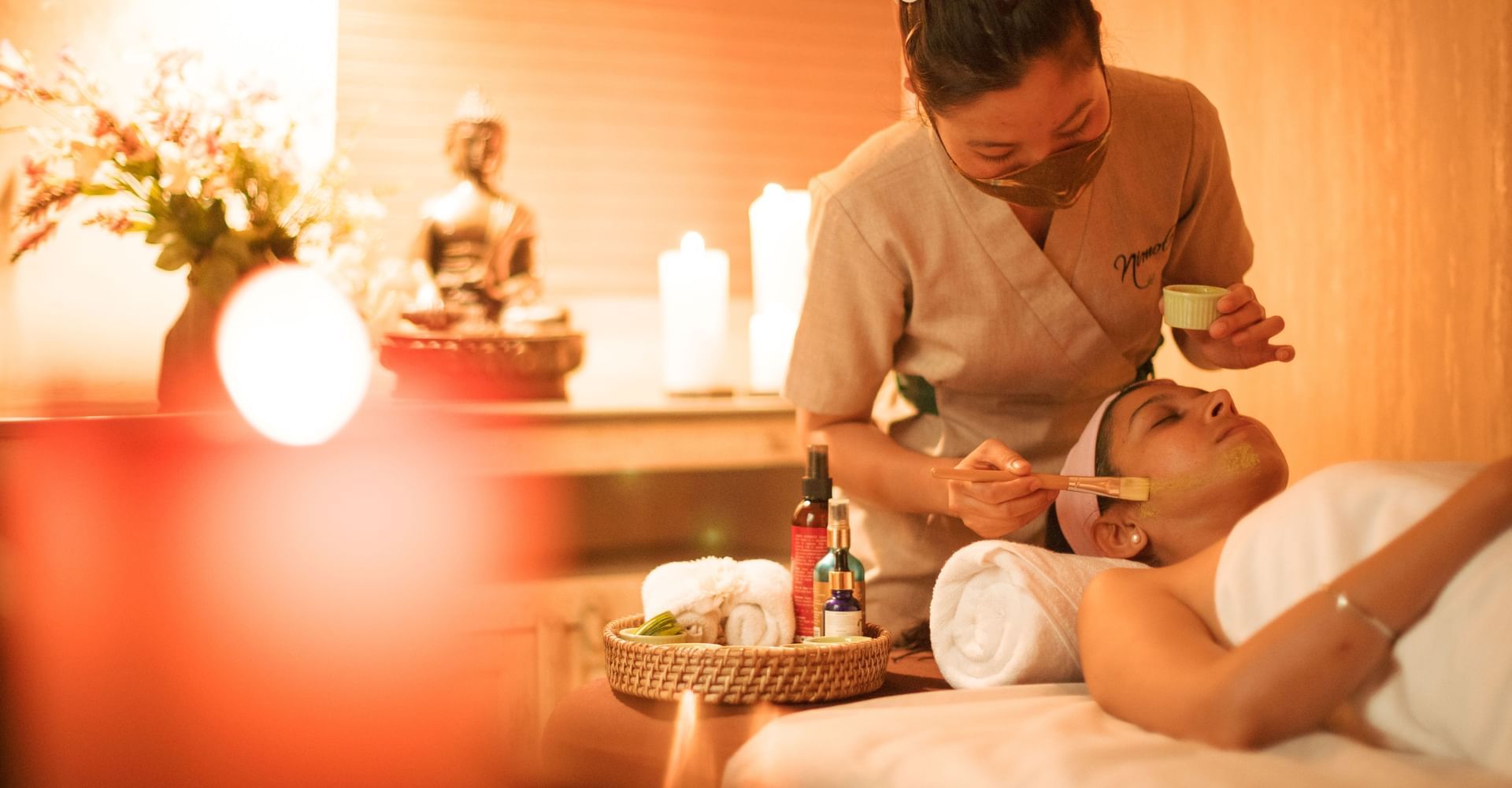 Guest receiving a soothing massage during a spa session in the wellness center at Karma Chalets.