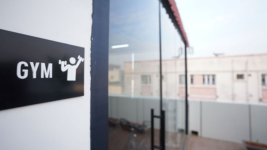 A close-up of a glass door entrance with the Gym sign at Hotel Kyzen Smartstays – Smart, Reliable, Kyzen