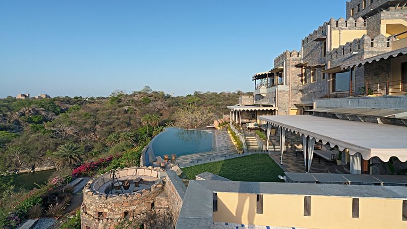 side view of Chunda Shikar Oudi with the swimming pool and forest cover with the blur sky in the background