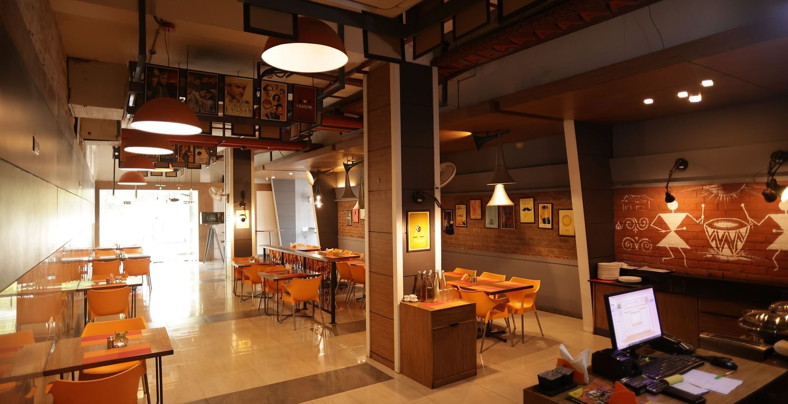 full view image of the dining area with ample walking space around the tables - Max Hotel, Jabalpur