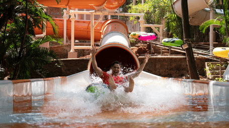 Aquadrenaline Vortex at Water Kingdom where a man is sliding down into the water | Weekend trip near Pune