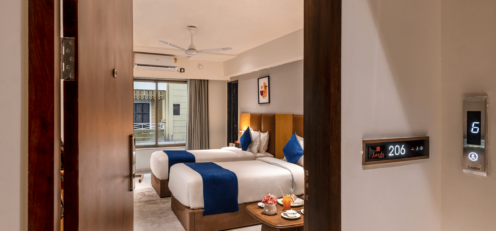 Entrance view leading to a stylish accommodation space at Lords Studio Inn, Jamnagar.