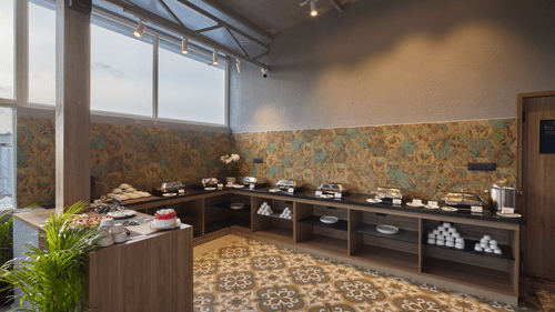 A warmly lit buffet area in our restaurant in Mysore