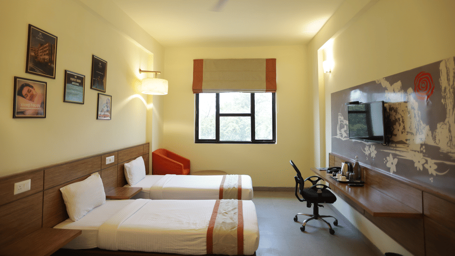 Max Club Room, offering a spacious and modern setting with subtle, tranquil colours.