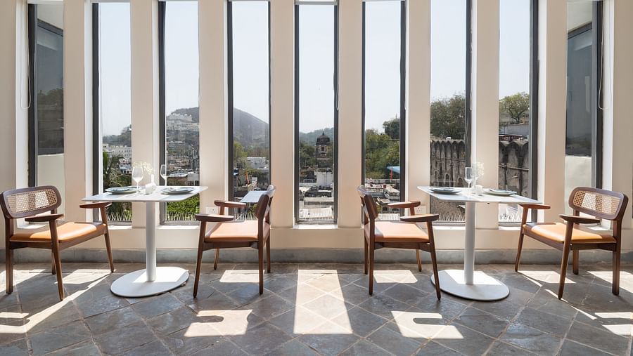 Seating arrangements inside a restaurant at Manuscript - Jhilwara Haveli, Udaipur