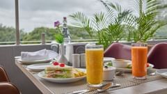 A close up shot of delicious food and drinks placed on a table