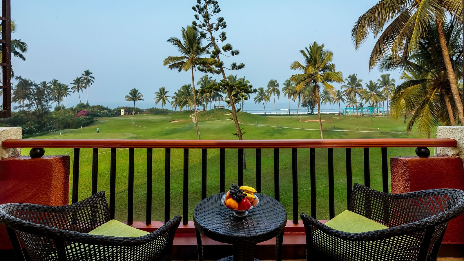 two chairs and a table in the balcony of Ocean front view - Caravela Beach Resort Goa