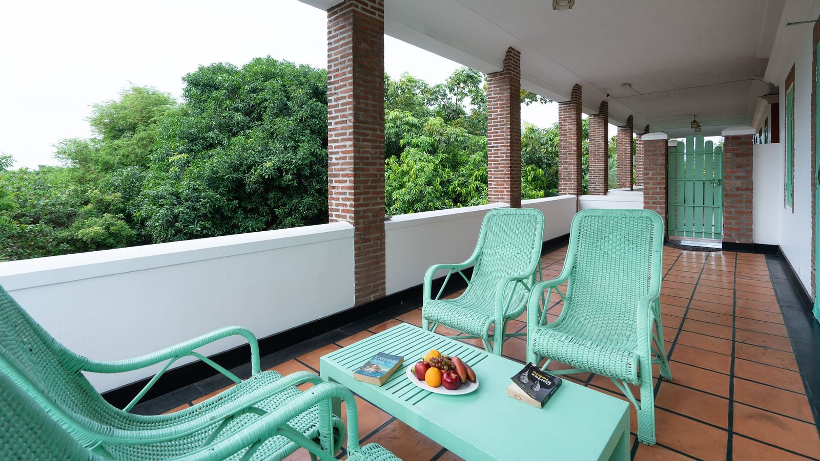 Suite Balcony  with turquoise chair and table.
