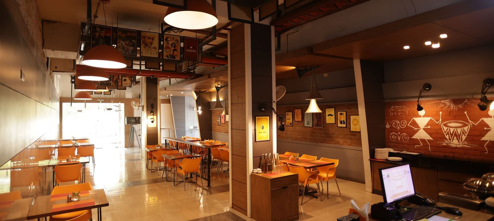 full view image of the dining area with ample walking space around the tables - Max Hotel, Jabalpur
