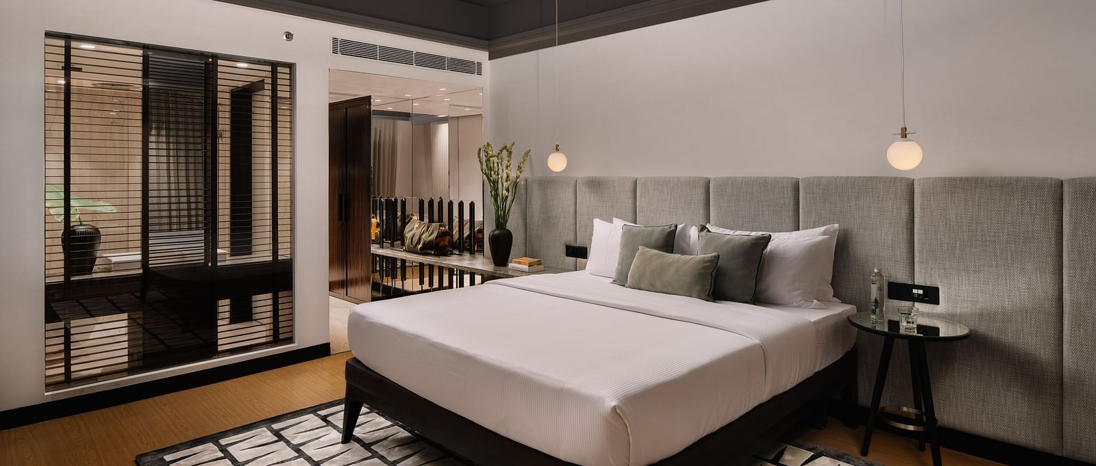 Overview of Apartment room at The Raintree St. Mary s Road with a bed and classy decor.