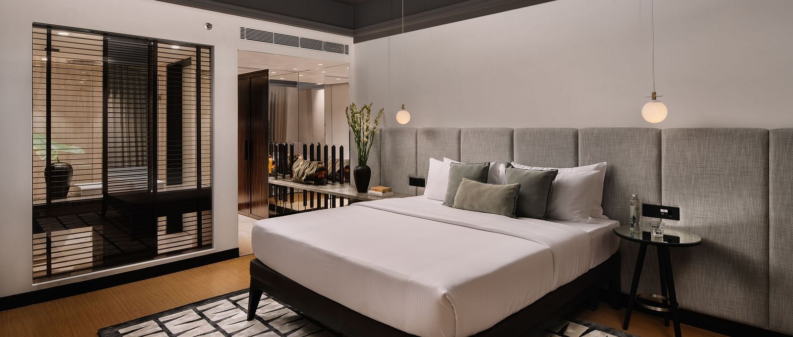 A room with a bed and a carpet below it at The Raintree Hotel, St. Mary's Road.