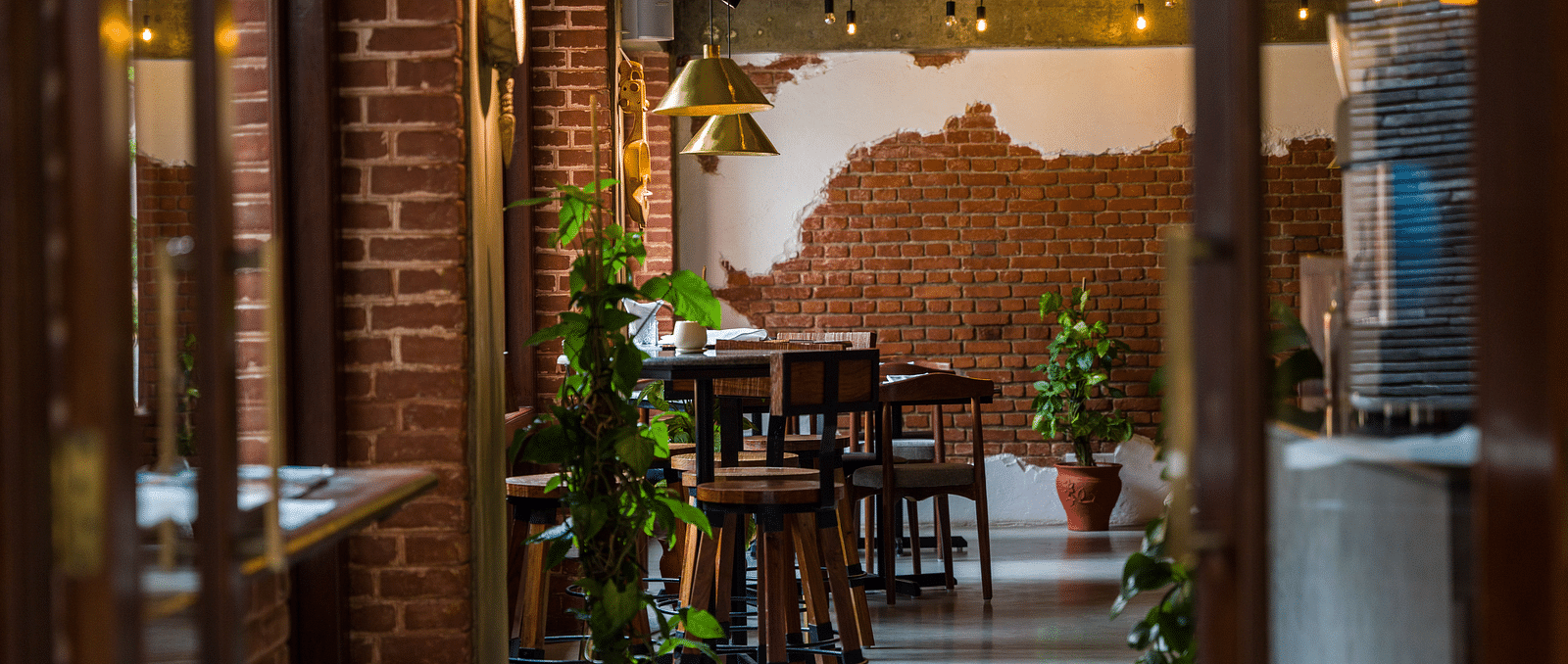The community bistro at The Nanee with seating arrangement and decorative plants